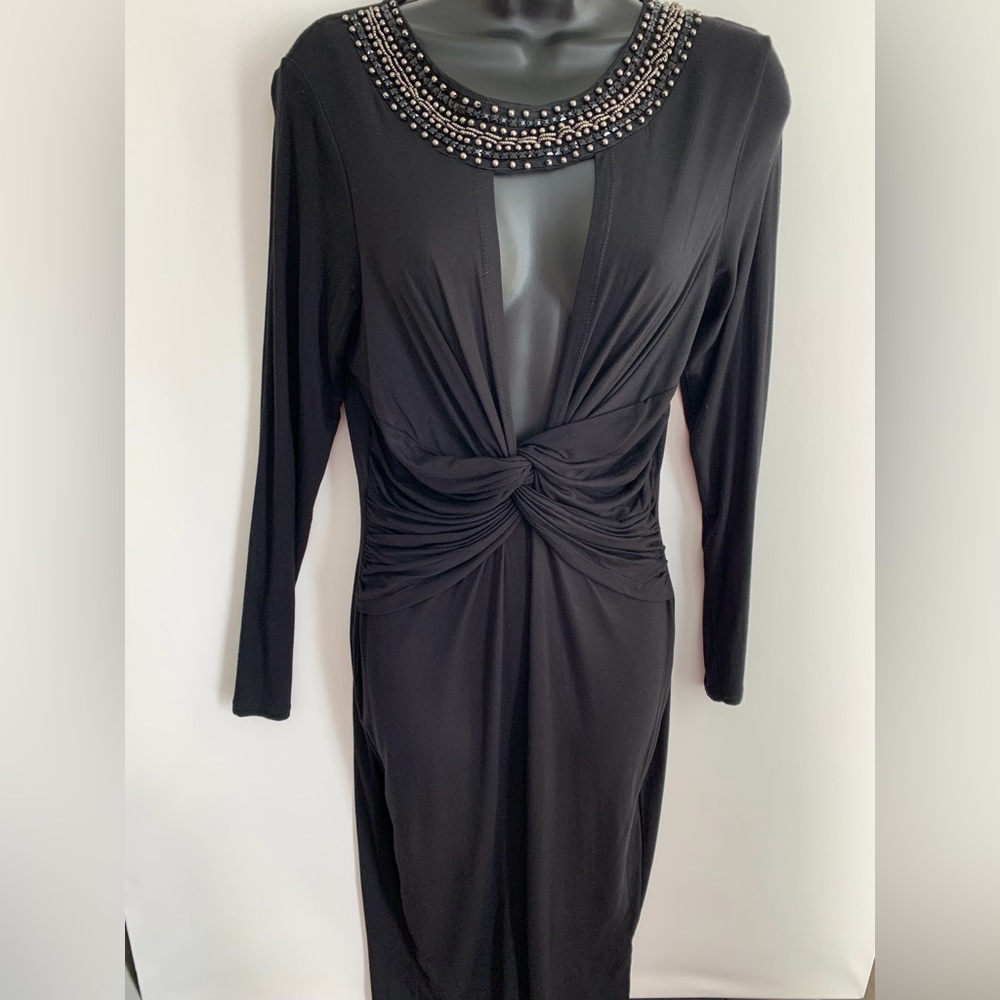 Sexy bodycon black party dress . Shows off curves. Beaded sparkly neck detail.